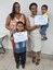 As irmãs Tais (E) e Rosalina Flausino comemoram com os filhos a conclusão do curso